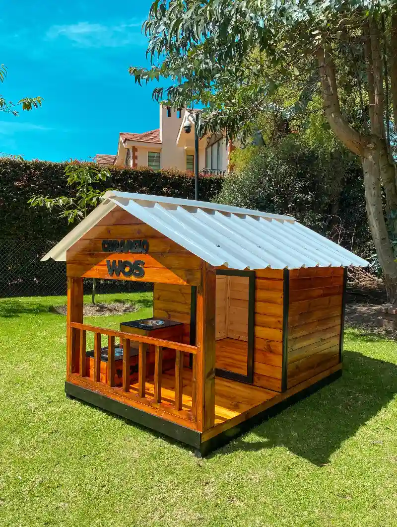 Stained Redwood Cabin with Corrugated Metal Roof and Custom Name Lettering