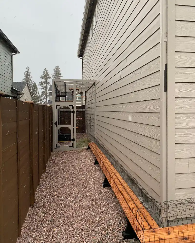 Tan Side-Yard Tower with Low-Profile Ground Tunnel and Gravel Pathway