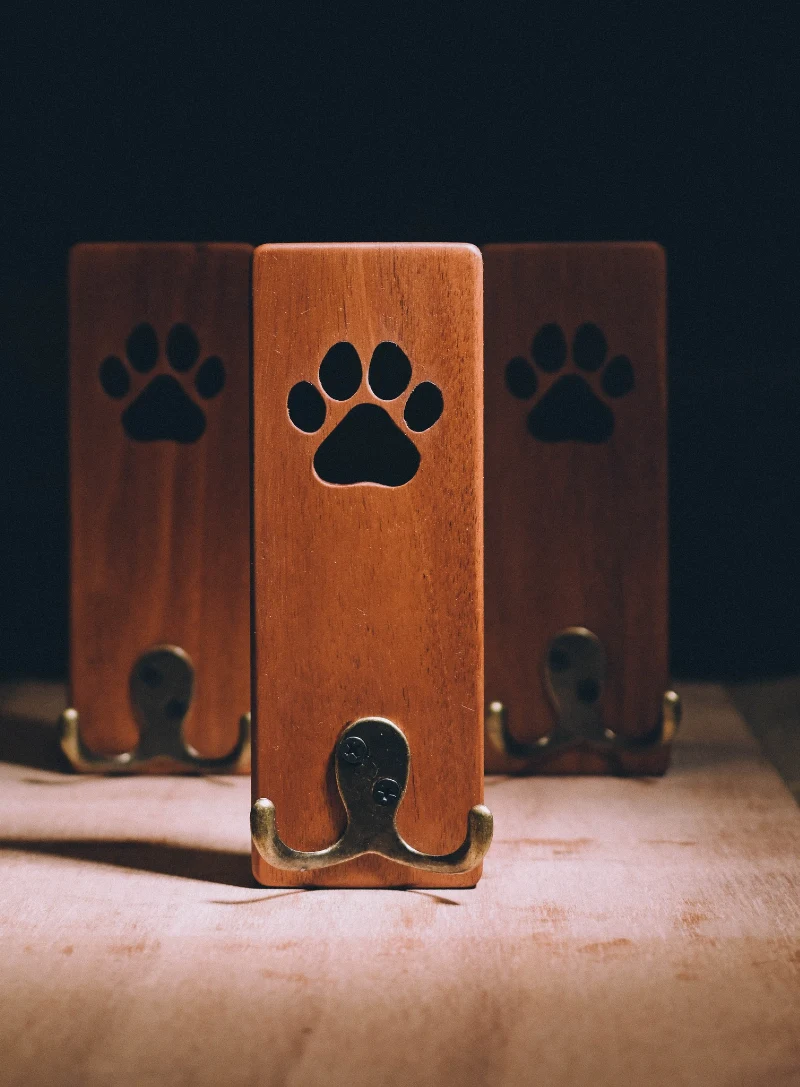 Teak Stained Wood Plaques with Cutout Paw Prints and Aged Brass Hooks