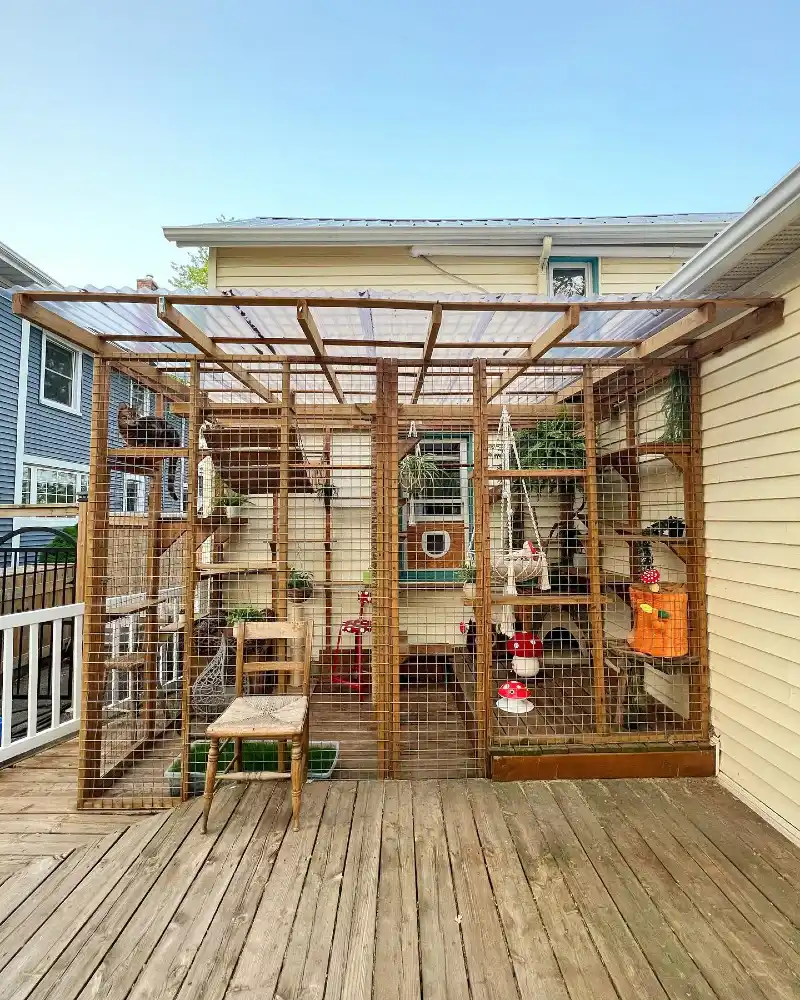 Timber-Framed Deck Enclosure with Corrugated Roofing and Macrame Hammock