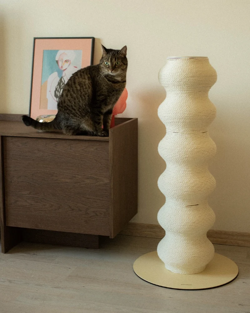 Totem Sisal Post Beside Dark Wood Cabinet