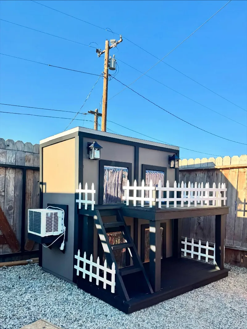 Two-Story Taupe Bunkhouse with White Picket Railings and Climate Control