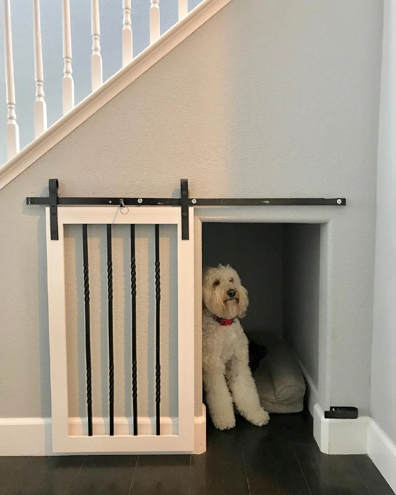 Under-Stair Alcove with White Sliding Barn Door and Iron Balusters