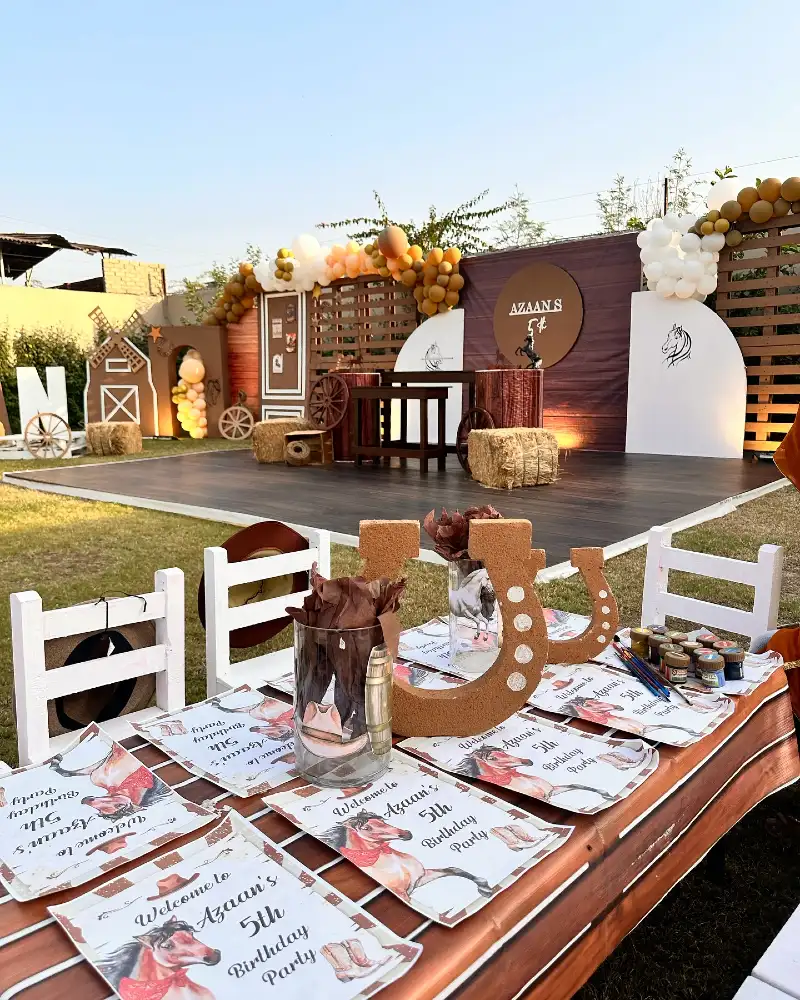 Western Horseshoe Centerpieces with Custom Activity Placemats and Wooden Stage Backdrop
