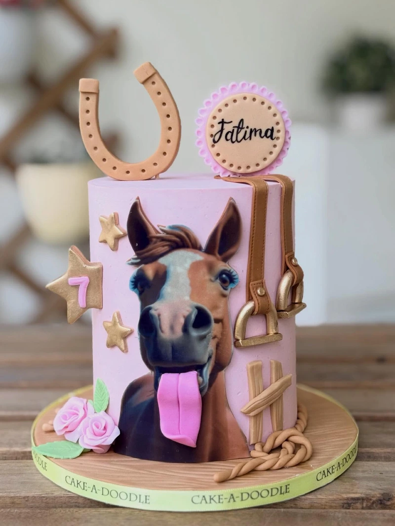 Whimsical Pink Cake with Silly Horse Portrait and Fondant Stirrups