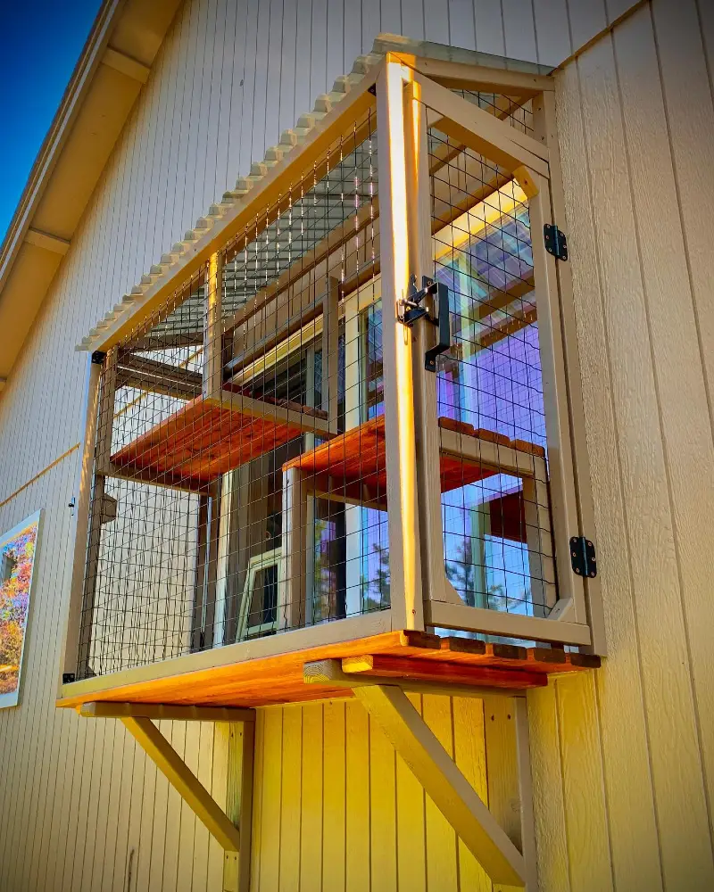 Window-Mounted Tan Catio with Under-Support Brackets and Warm Slatted Wood Floors