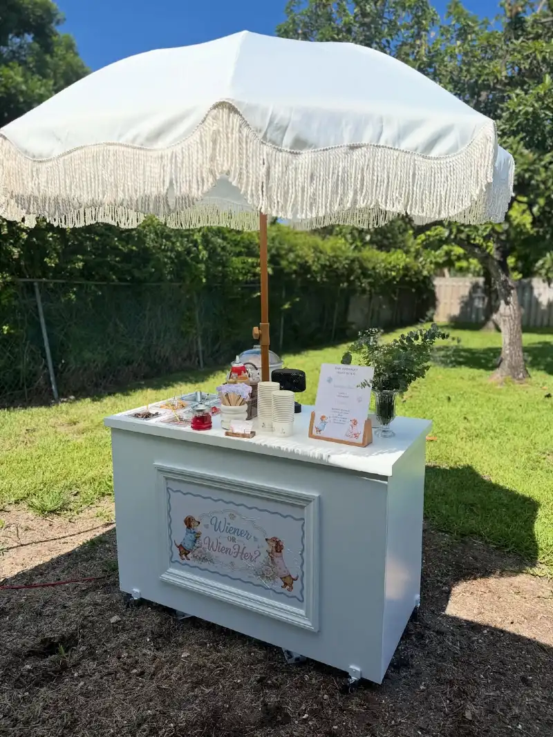 White Outdoor Cart with Fringe Umbrella and Wiener or Wien-Her Sign